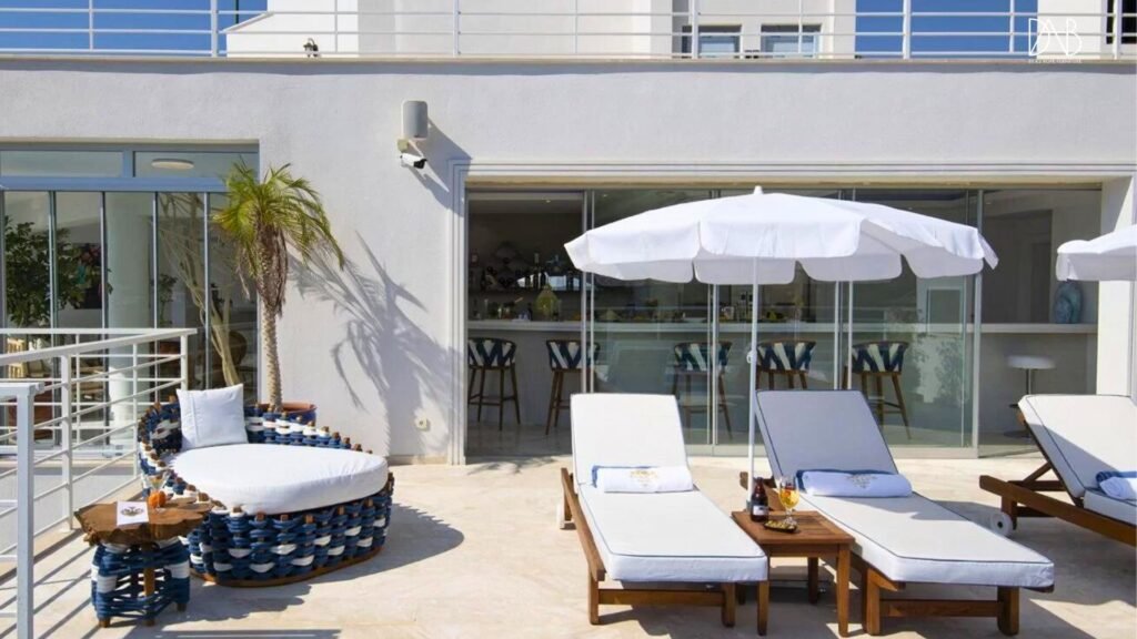 Set of day bed with side table beside sun loungers